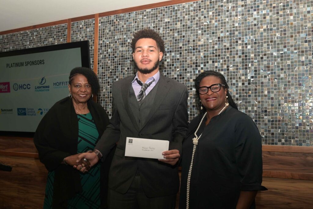 TOBA scholarship recipient receiving the Jetie Wilds Scholarship award during a recognition ceremony.