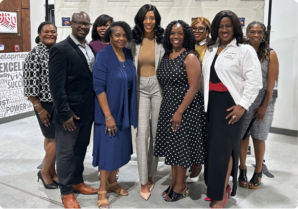 Tampa Organization of Black Affairs members and community leaders gathered for a group photo at a networking event.